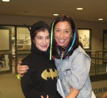 Carolynn Kaufman spends time with Ellie Routhier at a Halloween party last year at the New Canaan YMCA. Kaufman is the Director of Special Needs at the Y.