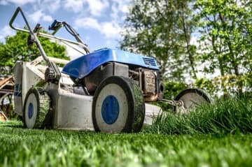 A man using an industrial lawn mower in Hunterdon County broke his leg after the machine slid down a hill, tipped over and trapped him Wednesday morning, state police said.
