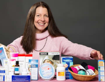 Margot Malin, founder of Lots to Live For, with an array of products that help cancer patients with the side effects of chemo, radiation, and surgery.