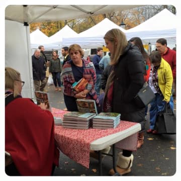 Hudson Valley resident Nancy Fuller signing her latest cookbooks at a recent special event at Rhinebeck Farmers Market.