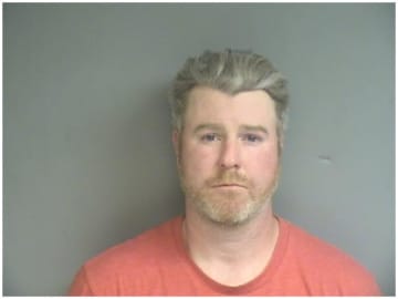 John Duffy, of Stamford, was charged Monday evening after his gun went off and shot his neighbor's house, while he was cleaning it. 