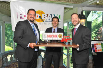 Chris Mazzarella (left), Bob Scher (right) and Tom Urtz of ShopRite accepted the Corporate Service Award.