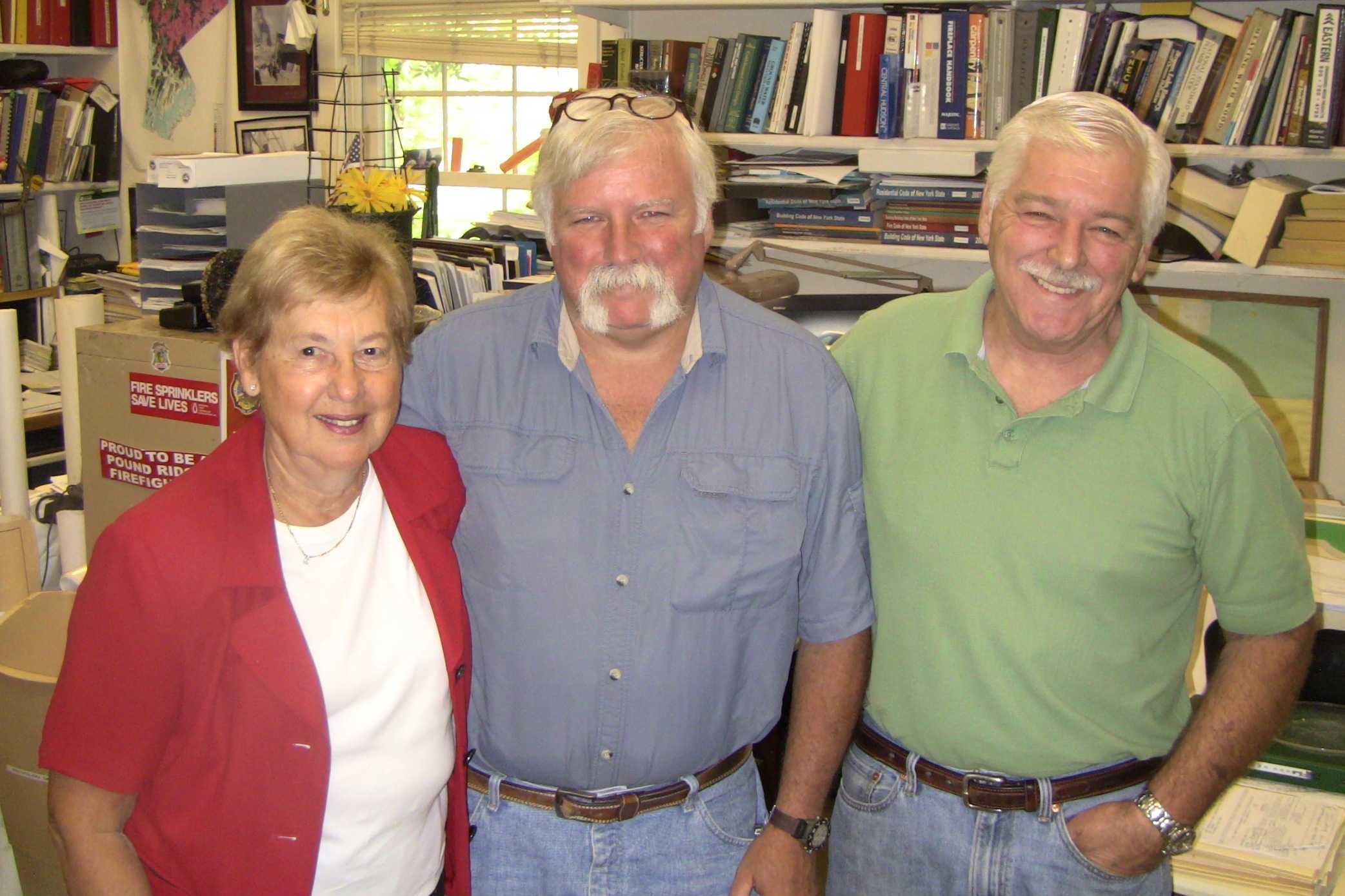 Charlotte Sasloff, left, James Perry, center,  and Arthur Travis work in the Pound Ridge Building Department.