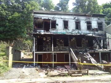 A two family home at 49 Hunter Street will be torn down after a fire early Wednesday morning.