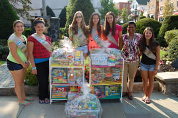 The Tuckahoe Girl Scouts donated books, book cases and new toys to the Andrus Early Learning Center recently. 