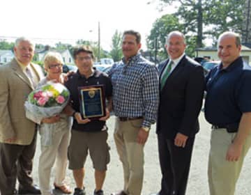 Eastchester officials presenting the Lanza Family Foundation with a plaque in appreciation for their donation.