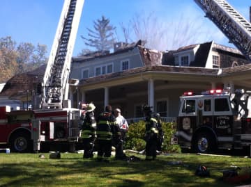Fire crews are battling a blaze at a home in Rye.