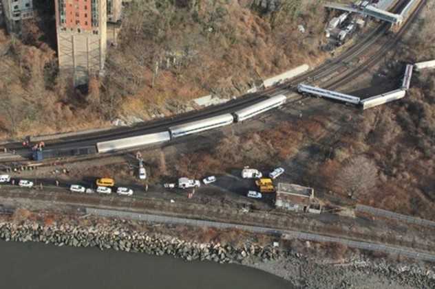 The engineer of the Metro-North train that derailed in the Bronx has been suspended without pay.