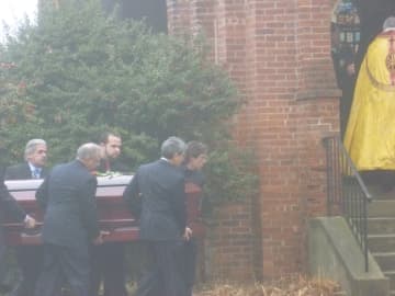 Pallbearers carry James Ferrari's casket at his funeral on Thursday.