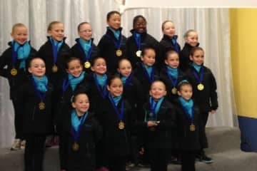 Lily Hudson and Ivey Rao of Darien skated for the Skyliners Beginner team that won a gold medal in Stamford on Saturday.
