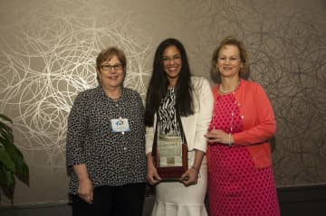 Wendy Caceres, center, was honored by Hudson Health Plan.