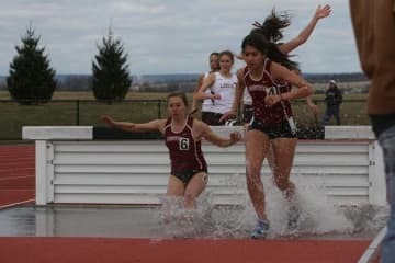 New Canaan's Stephanie Benko, left, competes in steeplechase for Lafayette College.