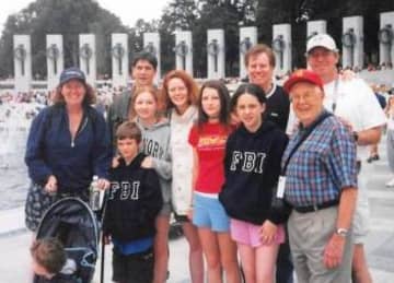 Leah Murphy, left, and her dad, John P. Lennon, front right,  anchor this picture taken at the World War II Monument in Washington, D.C, in 2004. 