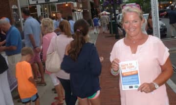 Tucker Murphy, executive director of the New Canaan Chamber of Commerce, during the Taste of the Town Stroll on Thursday evening. 