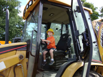 An Eastchester youngster enjoying the trucks at a past Touch-A-Truck event. 