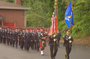 Wilton firefighters and police officers march in the tribute held Thursday morning in honor of those who died in the Sept. 11 attacks.