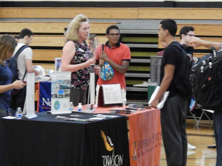A Tuckahoe High School student speaks with a representative from Buffalo State.