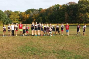 Runners from the New Canaan Blazers youth running team get ready to run in last week's cross country meet against St. Aloysisus and St. Luke's, where they took eight of the top 10 spots.