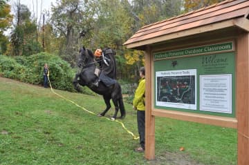 The Headless Horseman helps with the ribbon cutting at the Peabody Preserve Outdoor Classroom.