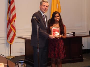 Mayor Thomas Roach presents Raina Kadavil with the White Plains Youth of the Year 2014 award.