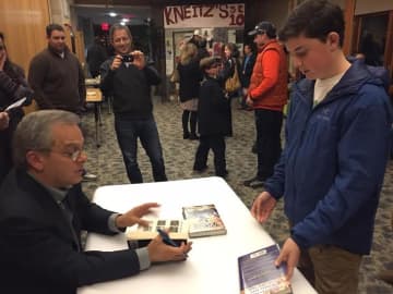 Tommy Wiesenberg of Larchmont meets renowned sports writer Mike Lupica Sunday following a community program called Harvey Presents: Mike Lupica in The Walker Center for the Arts in Katonah.
