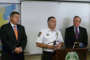 Wilton Police Chief Michael Lombardo, center, has taken the position as the new chief in Trumbull.