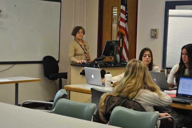 Mirla Morrison instructs first-grade teachers on the use of Putnam/Northern Westchester BOCESs Integrated Social Studies English Language Arts Curriculum.
