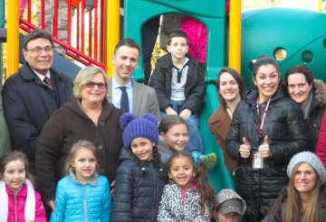 Park Childhood Center students, school officials and developer Martin Ginsburg gathered to celebrate the construction of a new playground for the center. 