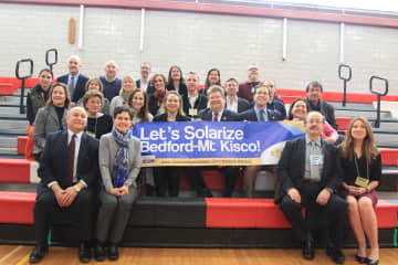 Officials from Bedford, Mount Kisco, the Bedford Central School District and Westchester County pose for a photo at the summit.