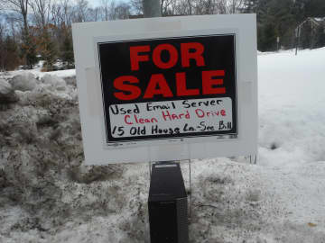 A mock for-sale sign lampooning news of Hillary Clinton using a personal email account for work as Secretary of State. The sign was posted near her home in Chappaqua, N.Y.