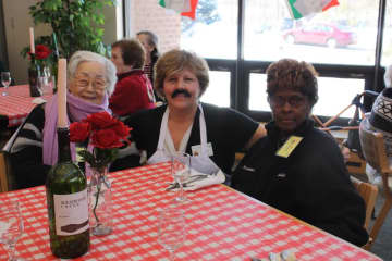 Seniors in the Waveny LifeCare Networks Adult Day Program enjoy a bistro lunch on around the world day. 