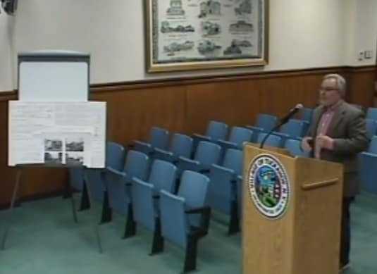 Scarsdale architect Leonard Brandes showing the plans for a possible Subway franchise in Tuckahoe. 