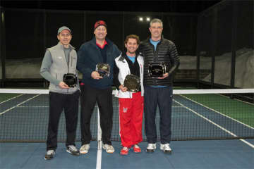 From left to right: Runners-up Brian OHara and R.P. Beuerlein with winners Rob Blosio Jr. and Colin White at Battle with a Paddle, a fundraiser for AmeriCares on March 7. 