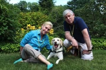 Jane Paley and Larry Price of Easton visit Silver Hill Hospital in New Canaan with their dog, Hooper.