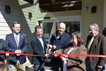 A ribbon cutting is held for the Lewisboro Library as part of its reopening following a massive renovation.