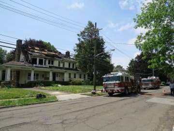 New Rochelle firefighters were at the scene of the fire more than 12 hours after responding to Paine Avenue. 