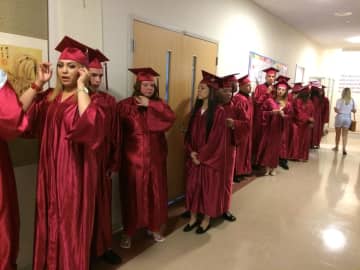 The graduates of Briggs High School in Norwalk lineup for commencement exercises. 