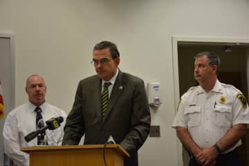 Westchester County police Commissioner George Longworth (center) at a press briefing. 