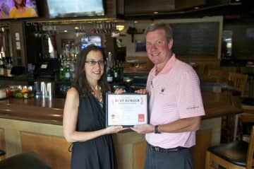 Daily Voice Features Editor Jeanne Muchnick presents first-place certificate to Bogey's Owner Jim Stablein.