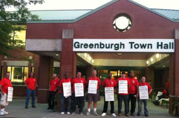 Greenburgh Department of Public Works employees picket a town board meeting in September. The Teamsters union finally settled a contract with the town board.