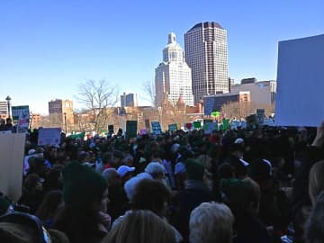 Thousands of people gather on the steps of the State Capitol in Hartford on Thursday to advocate for stricter gun control laws.