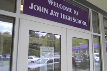 A student was charged with taking items from the locker room at John Jay High School.