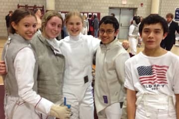Wilton High School fencers (from second left) Megan Roughan, Tessa Markham, Jai Nagpal and Liam Smith at Saturday's state fencing tournament. With them is Zoe Howard from Weston.
