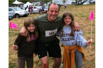 South Salem resident Pete D'Urso, pictured at the Boston Marathon with his daughters Julia and Amelia, is home safe with his family.