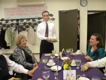 Michael Feist, of Briarcliff, serves the customers, including his mother, right, and BOCES board member Anita Feldman at "Educated Palate" in Yorktown Heights.
