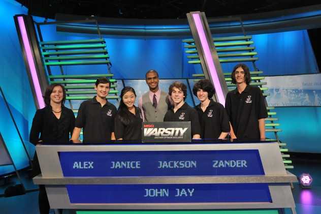 The John Jay High School team from left: academic adviser Vicky Weiss, Alex Lee, Janice Choi, The Challenge host Jared Cotter, Jackson Ruzzo, Alexander Bolgar and Angelo Angelino.