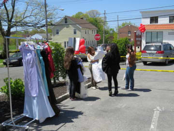 Shoppers peruse $1 prom dresses in Eastchester.