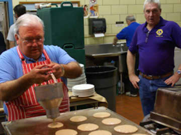 Members of Bergenfield Dumont Knights of Columbus make pancakes.