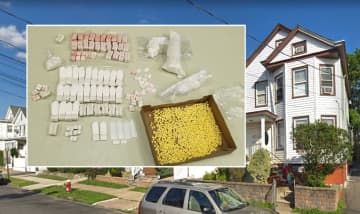 Detectives seized various drugs while raiding the house (right) on North 10th Street.