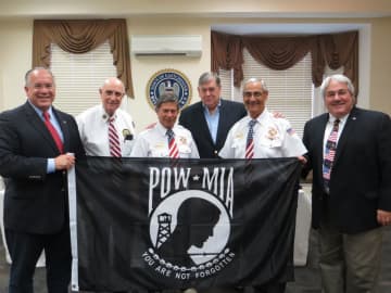 Eastchester Town Supervisor Colavita, VFW members Joe Mammana, Bob Foster, Mike Fix, Vinto Pinto and Tuckahoe Mayor Steve Ecklond with the flag that will fly over Town Hall.